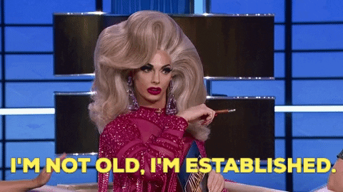 drag queen talking with the words I'm not old, I'm established 