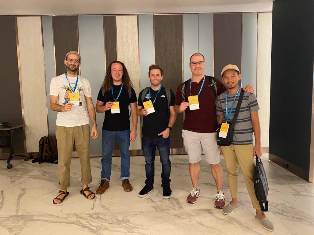 Freemius team posing with their WordCamp Asia 2023 ID tags