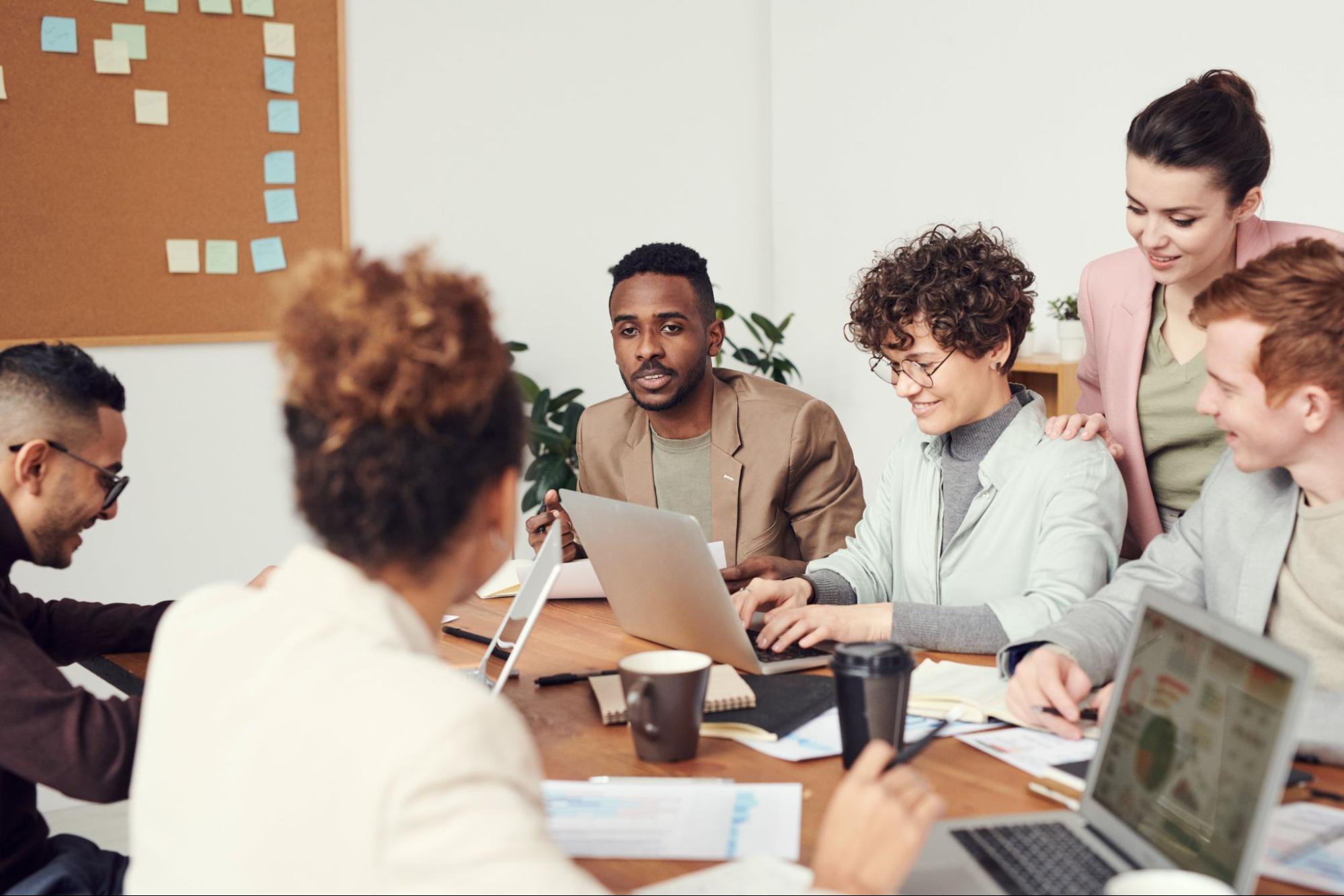 People sitting around a table testing a beta program