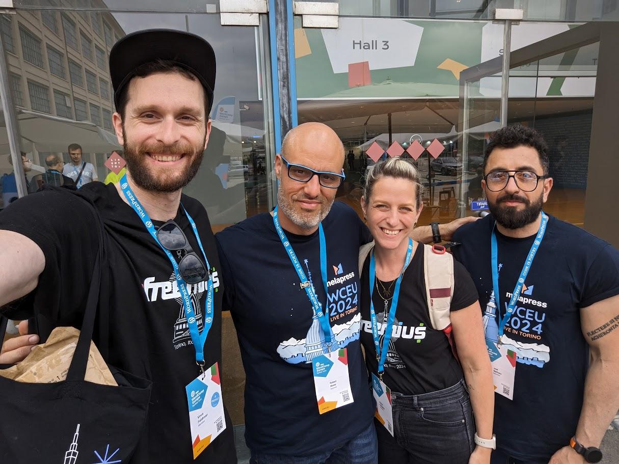 Vova Feldman and Hadas Golzaker taking a selfie with attendees at WordCamp Europe 2024