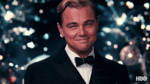 Leonardo DiCaprio raising a glass GIF